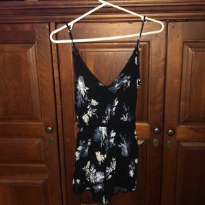 Black romper with blue and white flowers